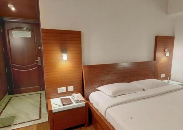 Parijatha Gateway Otel Bangalore Oda fotoğraf